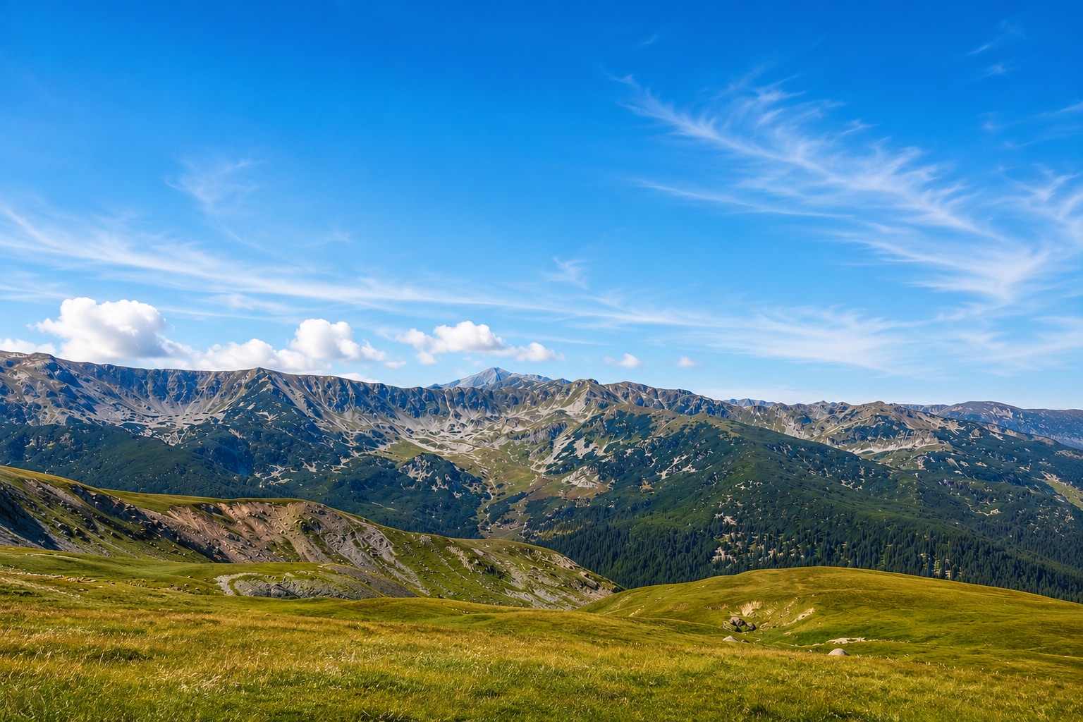 The Carpathian Mountains beneath a wide blue sky